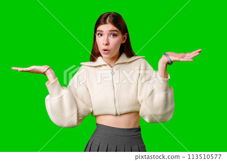 A woman wearing a white sweater is extending her hands outward in a gesture of offering or receiving. A woman wearing a white sweater is extending her hands outward in a gesture of offering or receiving. 113510577