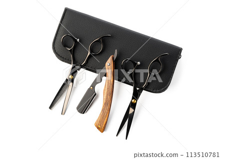 Hairdressing scissors with leather case on white background Hairdressing scissors with leather case on white background 113510781