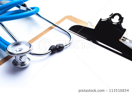Empty prescription lying on table with stethoscope 113510854