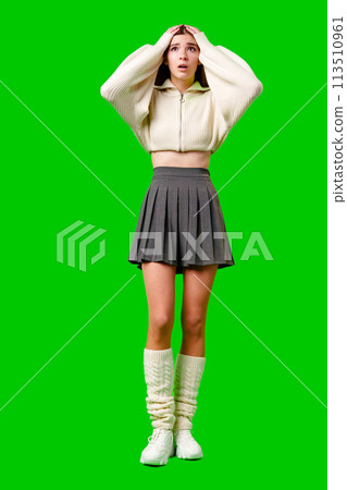 Young Woman Expressing Shock and Surprise Against a Green Screen Background Young Woman Expressing Shock and Surprise Against a Green Screen Background 113510961