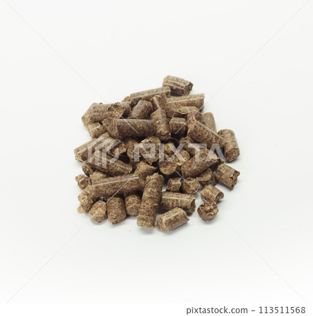 stack of wooden pellets for bio energy, white background, isolated 113511568