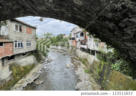 Building and river in Kemalpasha town near Sarp, Turkey 113511657