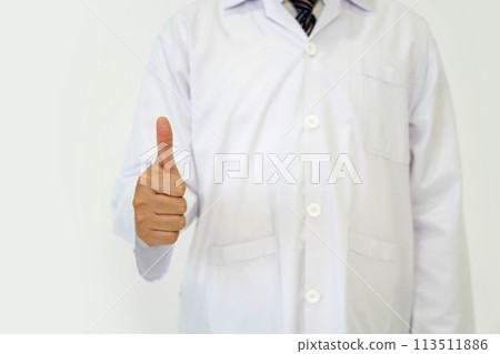 Doctor or scientist in a white lab coat standing with finger thumbs up. Portrait on white background, studio shot. 113511886