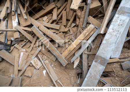 A messy heap of leftover wooden pieces is stacked in a pile. Top view 113512113