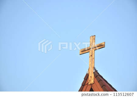 cross on rooftop of Christian church in sky background cross on rooftop of Christian church in sky background 113512607