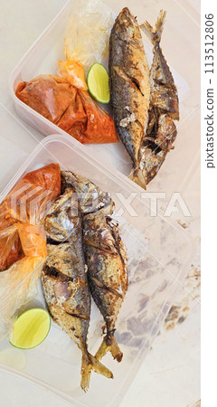 Fried Mackerel served with separate chili sauce and lime, or called Ikan kembung goreng. ikan banyar goreng Fried Mackerel served with separate chili sauce and lime, or called Ikan kembung goreng. ikan banyar goreng 113512806