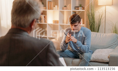 Psychology session. Depressed man. Mental health. Psychiatrist counseling stressed male patient on consultation treatment appointment. 113513156