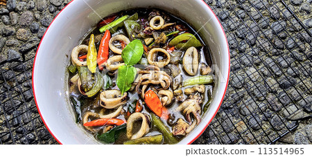 ndonesian home cooking menu, sauteed squid with black ink sauce with spicy seasoning called Tumis Cumi Hitam, including chili, ginger, and lime leaf ndonesian home cooking menu, sauteed squid with black ink sauce with spicy seasoning called Tumis Cumi Hitam, including chili, ginger, and lime leaf 113514965
