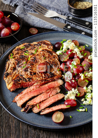 fried beef steak with salad of grape, cheese fried beef steak with salad of grape, cheese 113516381