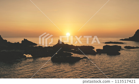 Mountain silhouette at sunset seascape aerial. Rocks of tropic island at ocean bay. Summer paradise Mountain silhouette at sunset seascape aerial. Rocks of tropic island at ocean bay. Summer paradise 113517421