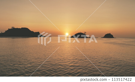 Timelapse of sunset seascape at mountain island silhouette aerial. Nobody nature landscape Timelapse of sunset seascape at mountain island silhouette aerial. Nobody nature landscape 113517422
