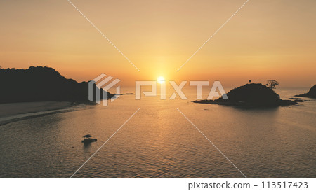Sunset seascape of ocean bay at tropic islands aerial. Nobody nature landscape with palm trees Sunset seascape of ocean bay at tropic islands aerial. Nobody nature landscape with palm trees 113517423