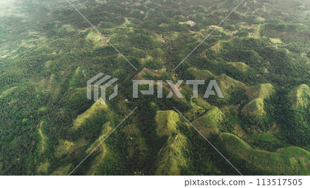 Top down mountain burnt peak grass aerial view: tropic jungle Quitinday hills of Mayon, Philippines 113517505