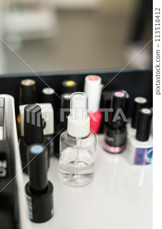 Nail and cuticle care products. Cosmetic oil for softening cuticles. Nails polish on background 113518412