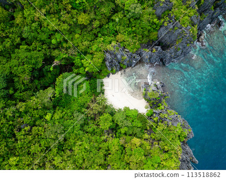 Tropical white sand beach and blue sea. Miniloc Island. El Nido, Palawan. Philippines. Tropical white sand beach and blue sea. Miniloc Island. El Nido, Palawan. Philippines. 113518862