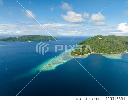 Drone view of turquoise water and corals in tropical island. Punta Corazon in Romblon, Philippines. 113518864