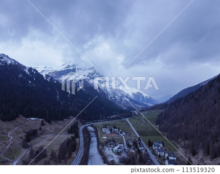 Mountain with snow, on top of a mountain. Forest with the city. Alps 113519320