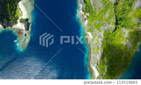 Coastline with sandy beaches and blue sea. Tapiutan and Matinloc. El Nido, Philippines. Coastline with sandy beaches and blue sea. Tapiutan and Matinloc. El Nido, Philippines. 113519865