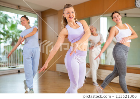 Dynamic middle-aged woman dancing hip-hop 113521306