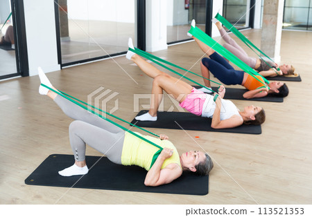 Group of women doing stretch exercises Group of women doing stretch exercises 113521353
