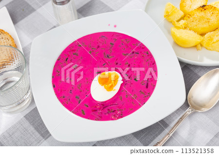 Appetizing traditional Belarusian cold vegetable soup Holodnik with cucumber and egg 113521358