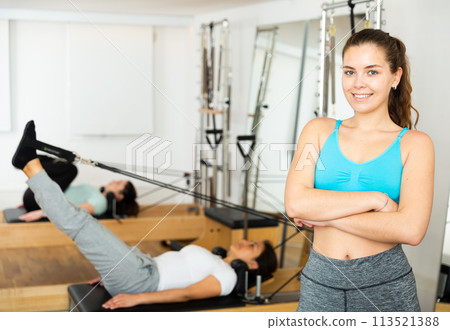 Smiling girl in sportswear posing in pilates studio 113521388
