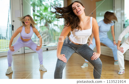 Group are practising arch movement in step jazz dance in fitness gym Group are practising arch movement in step jazz dance in fitness gym 113521914
