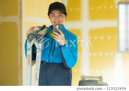A young man working in the interior design industry A young man working in the interior design industry 113522439