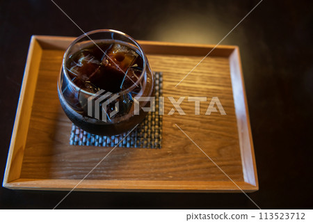 Ice Americano black coffee on wooden table by top view 113523712