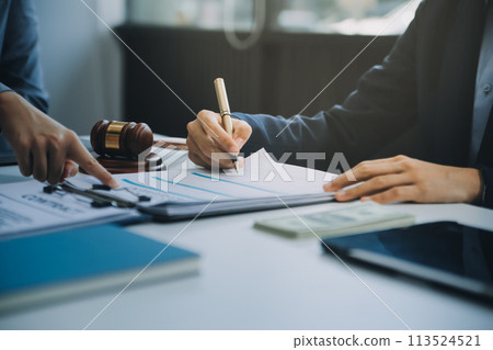Businessman and lawyer discuss the contract document. Treaty of the law. Sign a contract business. 113524521