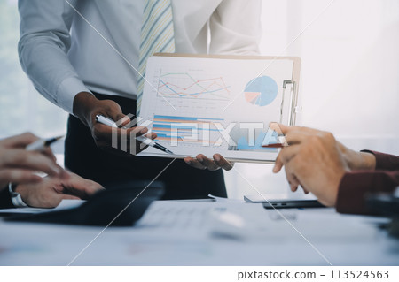 Business team working with new startup project plan and discussion information for financial strategy with laptop and digital tablet in a modern business lounge. 113524563