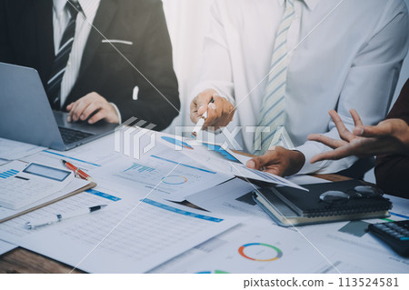 Business team collaboration discussing working analyzing with financial data and marketing growth report graph in team, presentation and brainstorming to strategy planning making profit of company. 113524581