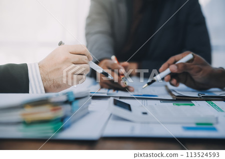 Business idea. Business people talking And calculations about charts and graphs showing the growth of investment results Of successful teamwork Business idea. Business people talking And calculations about charts and graphs showing the growth of investment results Of successful teamwork 113524593