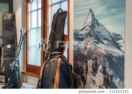 Luxury hotel room in Zermatt with winter sports gear and iconic Matterhorn print. Warm ambiance and alpine wildlife elements. Perfect for ski enthusiasts. Luxury hotel room in Zermatt with winter sports gear and iconic Matterhorn print. Warm ambiance and alpine wildlife elements. Perfect for ski enthusiasts. 113525141