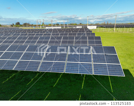 Solar panels on field in summer, aerial drone view Solar panels on field in summer, aerial drone view 113525183