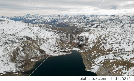 Aerial view of the Snowy Andes and Maule Lagoon at the Pehuenche border crossing between Chile and Argentina. 113525255