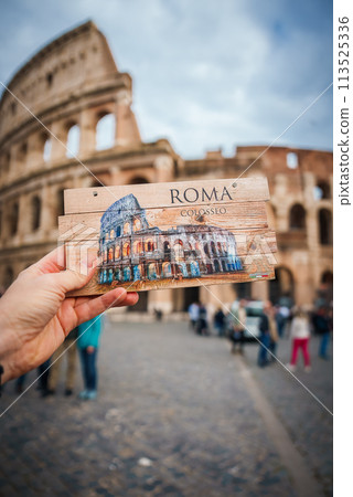 Creative perspective shot at the Colosseum, Rome, Italy. Postcard seamlessly aligns with the background, continuing the illusion of the real structure. 113525336