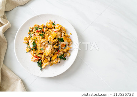stir-fried egg with Thai basil and chilli stir-fried egg with Thai basil and chilli 113526728
