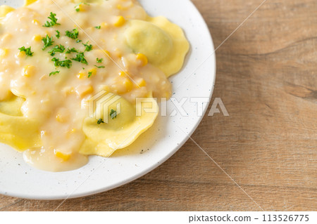 ravioli pasta with corn cheese sauce 113526775