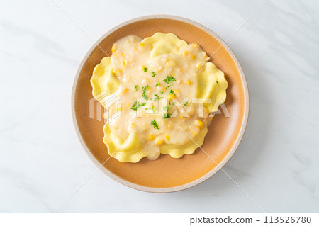 ravioli pasta with corn cheese sauce 113526780