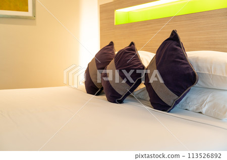 comfortable pillows decorate on bed 113526892