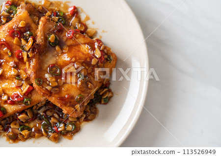 Fried Snapper Belly with Spicy Garlic Soy Sauce 113526949