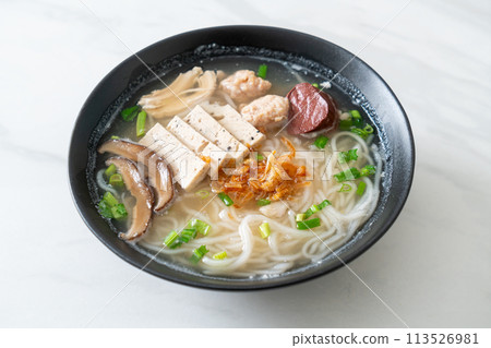 Vietnamese Rice Noodles Soup with Vietnamese Sausage served vegetables and crispy onion Vietnamese Rice Noodles Soup with Vietnamese Sausage served vegetables and crispy onion 113526981