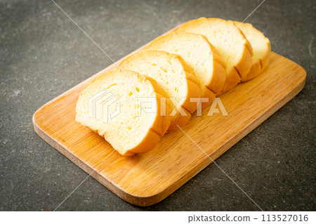 potatoes bread sliced on wood board potatoes bread sliced on wood board 113527016