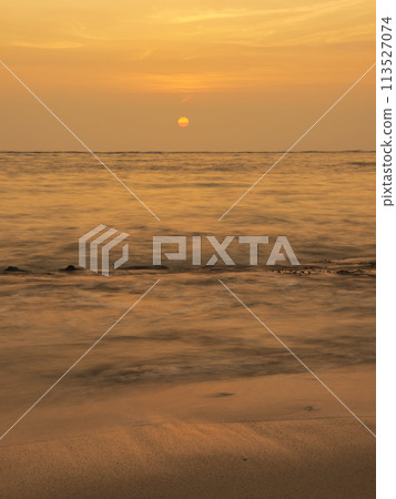 The sun setting in the sea of Okinawa 113527074