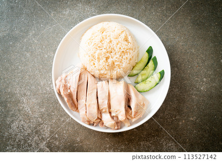 Hainanese chicken rice or rice steamed with chicken soup Hainanese chicken rice or rice steamed with chicken soup 113527142