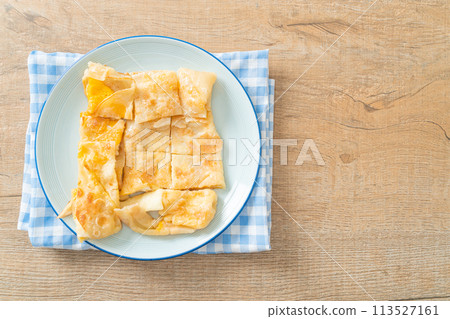 roti with egg and sweetened condensed milk 113527161