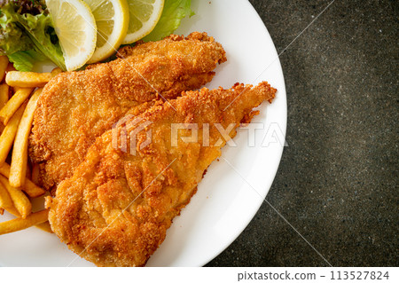Homemade Breaded Weiner Schnitzel with Potato Chips Homemade Breaded Weiner Schnitzel with Potato Chips 113527824