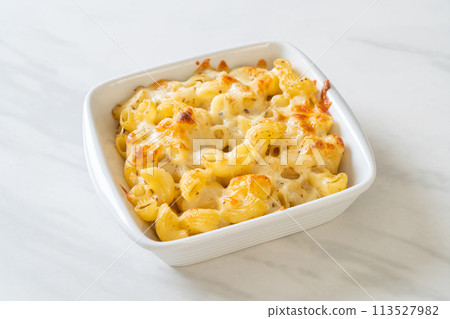 American mac and cheese, macaroni pasta in cheesy sauce 113527982