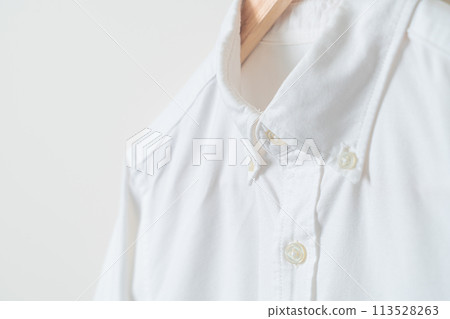 hanging shirt with wood hanger on wall hanging shirt with wood hanger on wall 113528263